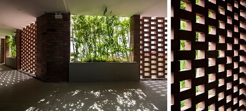 Tường được thiết kế với những mảng xanh lớn đón gió cho ngôi nhà